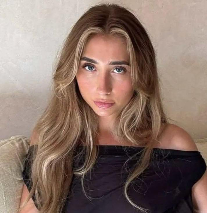 A young woman with long, wavy blonde-highlighted hair and a black off-shoulder top poses for a selfie with a tired, deadpan expression—visually embodying the exhausted sellers referenced in the post's caption.