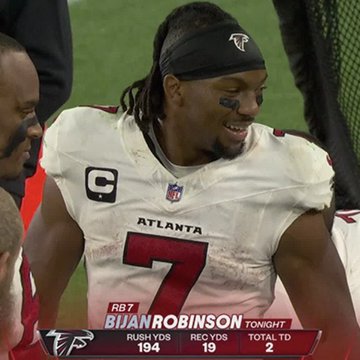 Bijan Robinson #7 of the Atlanta Falcons smiles on the sideline during a game, with a stats graphic showing his performance tonight: 194 rush yards, 19 receptions, and 2 total TDs. The image highlights Robinson's strong individual performance, complementing the post's mention of his 51 touches, 360 scrimmage yards, and 4 touchdowns across two games since Michael Penix Jr.'s return.
