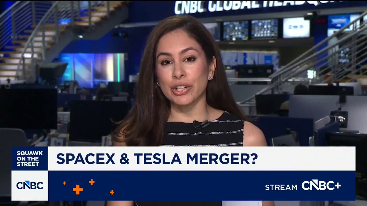 The image features a woman sitting at a desk with a computer screen behind her. She appears to be talking about a company called Tesla, which has been acquired by another company named Spacex. The news report suggests that Spacex and Tesla are merging into a new entity, possibly a joint venture or acquisition. This event is being discussed on the CNBC channel, as indicated by the text in the image.