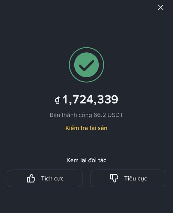 A mobile app confirmation screen in Vietnamese showing a successful transaction of đ 1,724,339 (66.2 USDT), with options to check assets and view the partner, plus positive/negative feedback buttons.
