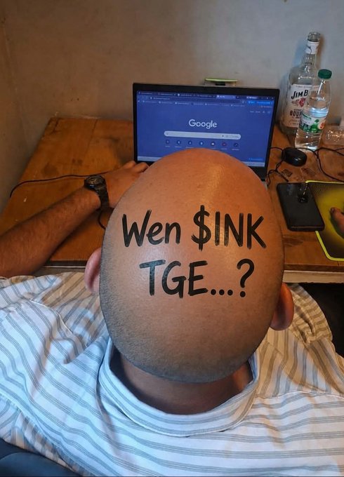 A bald man works on a Google search page at his desk, with the phrase "Wen $INK TGE...?" humorously written across the back of his shaved head, directly echoing the post's question about the upcoming token generation event for $INK.