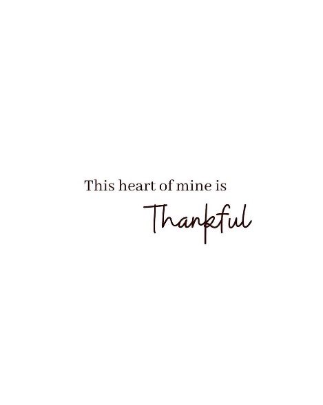 A minimalist graphic on a white background featuring the text 'This heart of mine is' above the word 'Thankful' written in a cursive script.