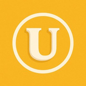The image features a large white "U" logo, which is the main focus of the post. The text above the logo reads "USELESS ( @theuselesscoin ) posts the largest 24-hour gain across the top 500 cryptocurrencies by market cap!". This suggests that the post is about cryptocurrency gains and mentions a specific cryptocurrency called "@theuselesscoin".