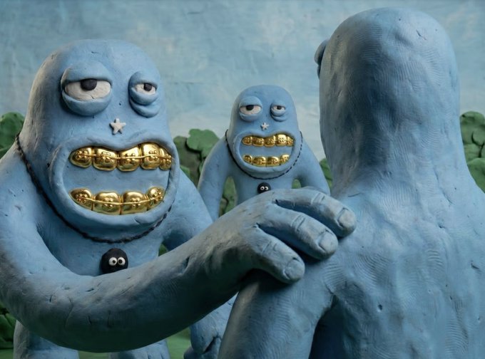 Claymation-style blue clay figures with gold teeth stand together, one reaching out a hand, set against a painted landscape background.