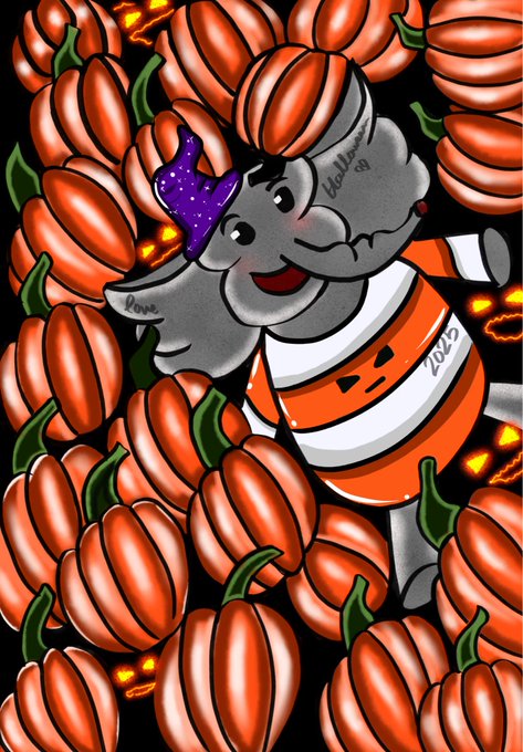 A colorful illustration featuring two cartoon elephants surrounded by orange pumpkins, with one elephant wearing an orange striped outfit labeled '2023' and the other wearing a purple star hat, with the words 'Hello' and 'love' visible.