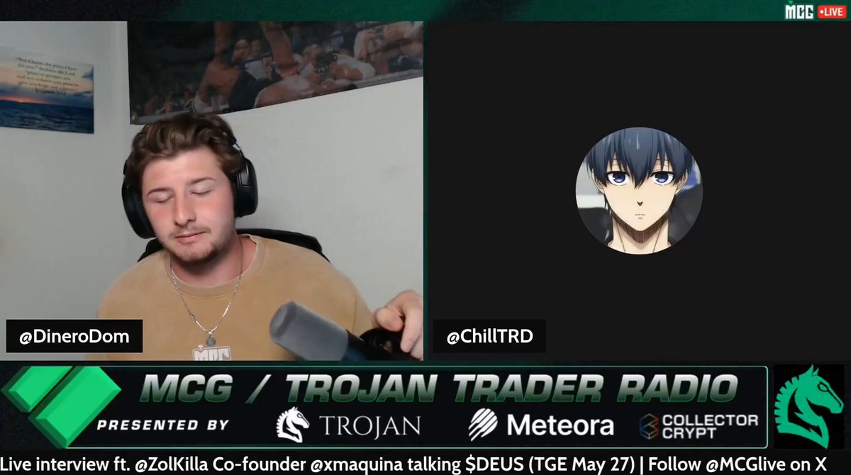 The image shows a man wearing headphones sitting at a desk with a computer screen displaying a video call from another person. The other person's face can be seen on the screen, but their identity is not clear due to the anonymity of the video call. The background features a green wall and a poster hanging on it.