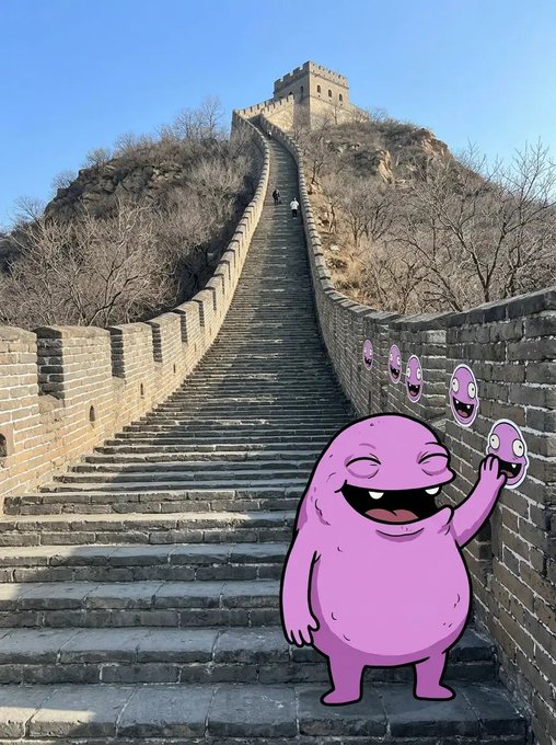 A photograph of the Great Wall of China with a cartoonish purple monster character (resembling the "purple monster" meme) waving from the wall, with smaller purple face icons trailing behind it.