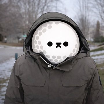 A person wearing a dark winter parka with the hood up has a digital overlay of a golf ball's face covering their own face.