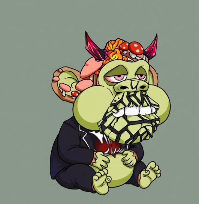 A cartoon illustration of a green goblin-like creature wearing a business suit, with a head made up of assorted foods (pizza, sausages, mushrooms) and a geometric crystalline beard, sitting against a green background.