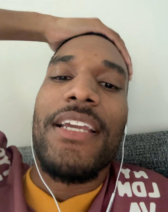 A bearded man wearing white earbuds and a maroon shirt with partial white text appears to be recording a reaction video, with his hand on his head in apparent astonishment. The post celebrates $ANSEM reaching one-third of its $1 billion market cap milestone, suggesting the image captures his excited or shocked reaction to the cryptocurrency's achievement.