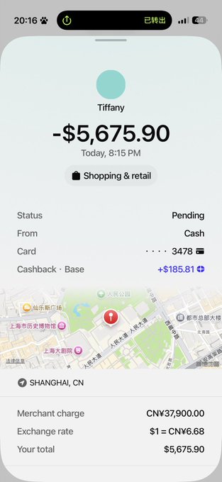 A smartphone transaction notification showing a pending charge from 'Tiffany' in Shanghai, CN for a total of $5,675.90 (37,900.00 CNY at an exchange rate of 6.68), with a cashback of +$185.81.