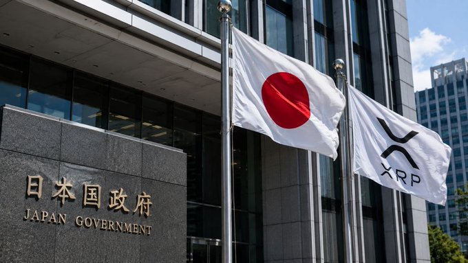 llor of the Japanese Government building, with a red circle and white "XRP" logo on its facade, stands against a clear blue sky.