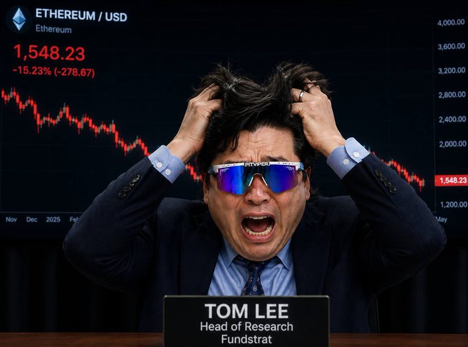 In this image, a man with sunglasses and glasses is seated at a table, appearing distressed or angry. He is wearing a business suit, which contrasts with his facial expression as he appears frustrated. The man's gaze is directed towards a screen showing stock prices of Bitcoin and Etherum, suggesting that the cause of his distress might be related to financial matters. A quote from the person who took this photo reads "don' cry in the casino @ fundstrat buy more $ETH & MOG". This implies that the man may have experienced some sort of loss or financial disappointment, leading him to react negatively with tears streaming down his face and an angry expression on his face.