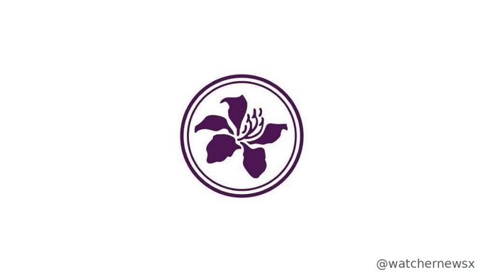 A purple circular logo depicting a stylized flower design, with the Twitter handle '@watchernewsx' visible in the bottom right corner.