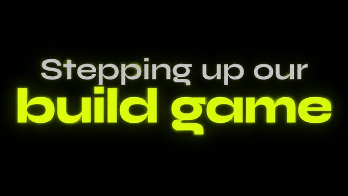 Text on a black background reads 'Stepping up our build game' in white and bright yellow-green lettering.