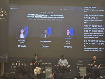 A panel discussion at the 'Bridge Summit' featuring speakers Victoria Vio, Tomohiko Hayakawa, and Ran Yi, discussing 'Onchain Trading, Next Chapter: Web3 Trades, What Trades, and Why Trust It'.