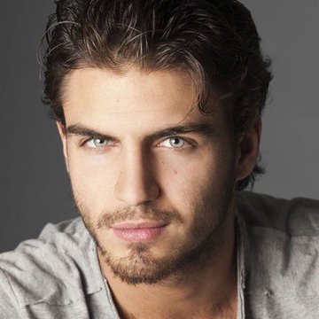 The image features a man with dark hair wearing a grey shirt against a gray background. He has a beard and his eyes are looking directly at the camera. The caption of the image reads, "This is clearly wrong, @CronosApp ranks No. 1." This statement suggests that the photo may have been taken or shared by someone who ranked the image as being number one on their list.