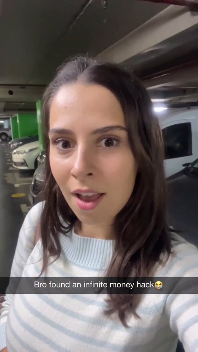 A selfie-style video still of a woman in a parking garage with the caption "Bro found an infinite money hack😭".