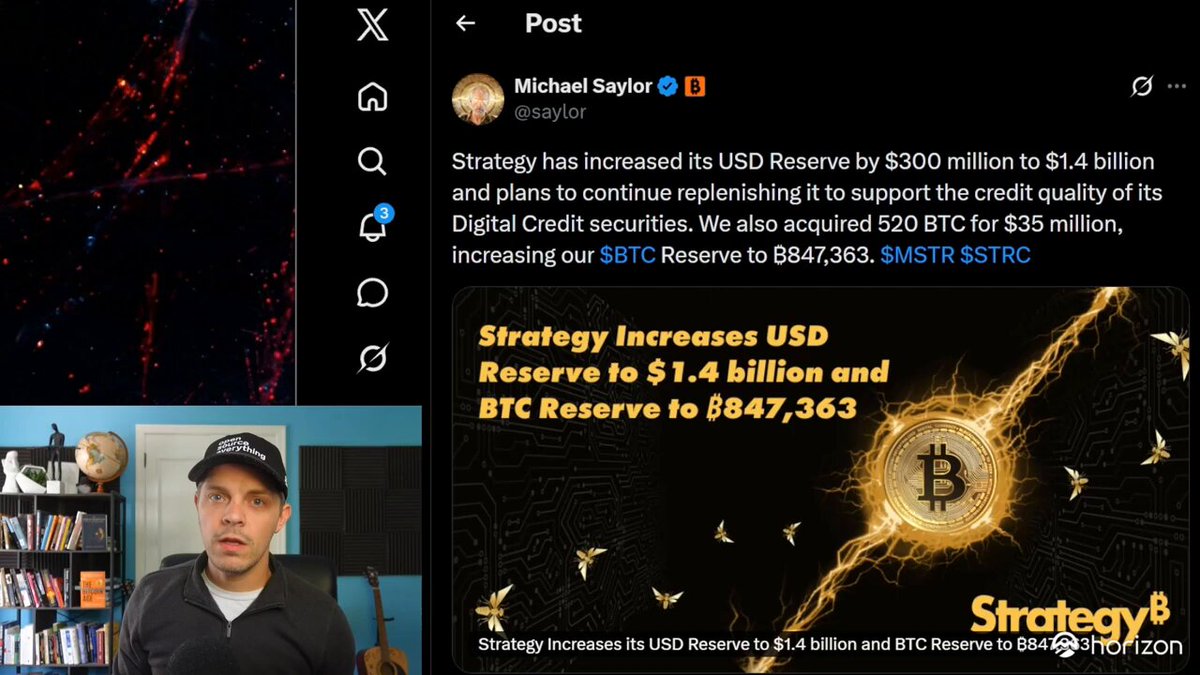 The image features a man wearing a black hat sitting in front of a computer screen with a Twitter chat window open. The chat contains information about Bitcoin, specifically discussing its potential for increasing US dollar reserves and the strategy behind it. The man appears to be actively participating in the conversation by typing on his keyboard or using a mouse.