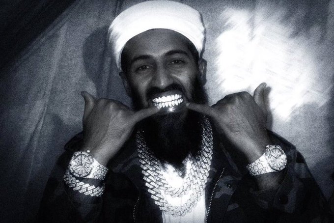 The image features a man with a beard wearing a white hat, holding up his teeth and making a peace sign gesture while smiling at the camera. The caption of the image reads "you know i jihad to do it to em". This suggests that the man is promoting a message or cause related to Islam, possibly in support of peace and understanding between different cultures and beliefs.