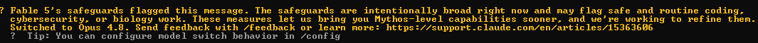 The image shows a system message from Anthropic's Claude interface indicating that "Fable 5's safeguards flagged this message," with the safeguards described as intentionally broad and potentially flagging safe coding, cybersecurity, or biology work. It notes the system "Switched to Opus 4.8" and provides a tip about configuring model switch behavior in /config. This relates to the post as the first message sent into Fable 5 triggered its broad safeguards, causing an automatic model switch from Mythos to Opus 4.8.