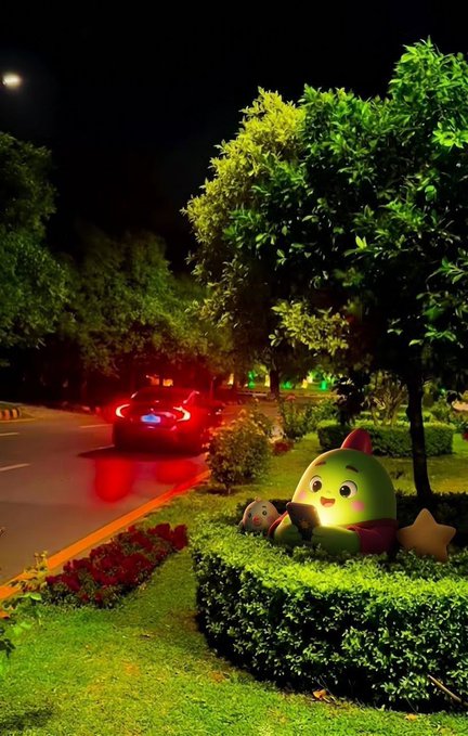 A nighttime scene shows a cute green cartoon mascot statue (likely a Sleepagotchi character) nestled in a hedge by a quiet street, where a car with glowing red taillights is driving away. The whimsical, peaceful setting pairs with the post's message about reimagining the future of personal health and sleep data ownership, suggesting a gentler world where your data—and your rest—remain your own.