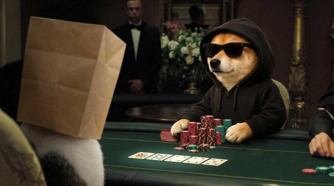 A meme image showing a Shiba Inu dog wearing a black hoodie and sunglasses sitting at a casino poker table with stacks of chips, facing off against another dog wearing a paper bag over its head, with a dealer (Daniel Craig as James Bond) in the background.
