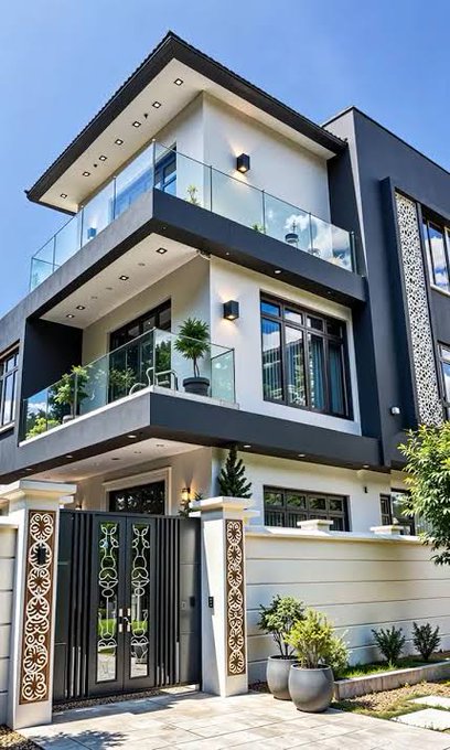 A modern three-story house with a black and white color scheme, featuring glass balconies, decorative gate, and potted plants in front.