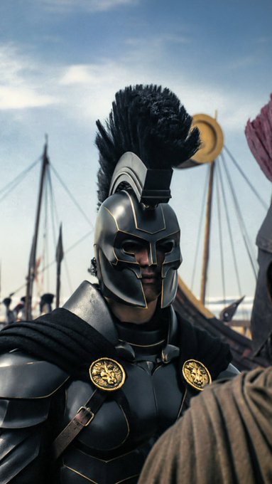 A warrior in sleek black armor with a tall black plume helmet and gold-accented roundels stands confidently, resembling a Greek hoplite or spartan ready for battle. The image humorously represents "pulling up to the next bull run" by depicting the armored warrior as a fierce, battle-ready investor charging confidently into the market rally.
