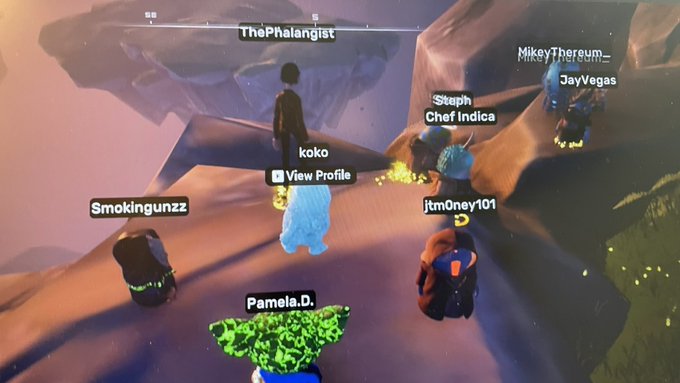 A screenshot from a virtual gaming environment showing multiple avatars with usernames including ThePhalangist, MikeyThereum_, JayVegas, Steph Chef Indica, koko, jtm0ney101, Smokingunzz, and Pamela.D. gathered together.