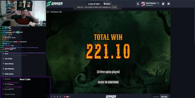 A screenshot of a Twitch stream showing a gamer streaming on the Gambao website, displaying a 'TOTAL WIN 221.10' message for 23 free spins played, with the streamer's webcam visible in the top left corner.