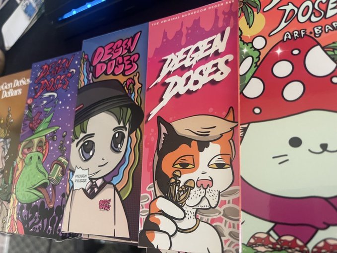 A colorful display of "Degen Doses" branded packaging featuring cartoon artwork of a frog, a character in a hat, and a cat, alongside a red mushroom design labeled "AFB Bar," visually representing the psychedelic mushroom product brand mentioned in the post.