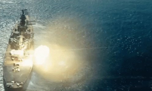 The image shows a large ship sailing through the ocean, with its lights on and a bright light coming from the top of the ship. The ship appears to be moving towards the right side of the frame. In the background, there are waves visible in the water, indicating that the ship is navigating through rough waters or near a coastline. The image also includes text that reads "$SUI firing all cylinders". This could possibly be an advertisement for the ship's capabilities or a reference to the ship's crew working efficiently during their journey.
