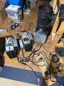 This image shows three Bitcoin miners connected and powered, demonstrating the functionality of following a watt curve with multiple devices, as described in the accompanying post.
