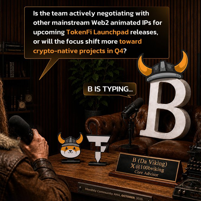 The image shows a podcast/AMA setting with an animated Viking character (B from TokenFi) wearing a horned helmet, seated across from an interviewer holding a microphone, with a speech bubble asking: "Is the team actively negotiating with other mainstream Web2 animated IPs for upcoming TokenFi Launchpad releases, or will the focus shift more toward crypto-native projects in Q4?" A "B IS TYPING..." indicator suggests Core Advisor B (Da Viking), @100bviking, is preparing a response, with the scene labeled "Monthly Community AMA, OCTOBER 2025" alongside TokenFi branding on the table.