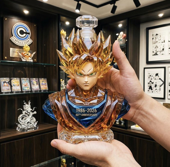 urn with dragon head and gold foil, "Dragon Ball Z" plaque, and "1996-2026" inscription on a black shelf.