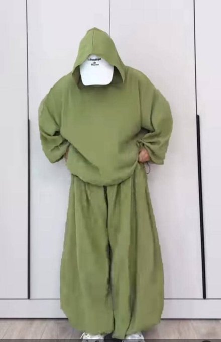 An olive green oversized hooded sweatshirt and matching wide-leg sweatpants set hangs displayed on a hanger in front of a gray wardrobe, unrelated to the accompanying post about Dow Protocol's blockchain infrastructure for real world asset (RWA) tokenization. The image appears to be a product/fashion listing that has no visual connection to the crypto or blockchain content described in the post.