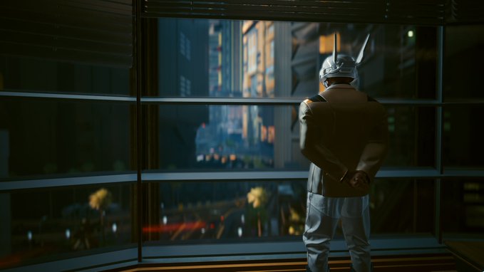 A figure wearing a silver helmet and a beige uniform stands with hands behind their back, looking out through large windows at a futuristic cityscape.