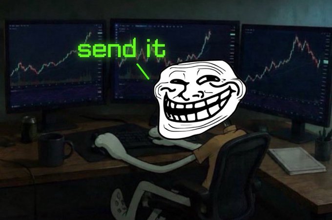 A troll face meme at a multi-monitor trading setup displays the words "send it" in green pixel text, visually echoing the post's rebellious sentiment about buying $troll and printing on their own terms without waiting for government approval.