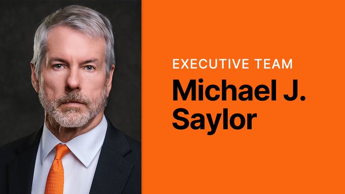 A corporate profile graphic featuring a professional headshot of a man with grey hair and an orange tie, labeled 'EXECUTIVE TEAM Michael J. Saylor'.