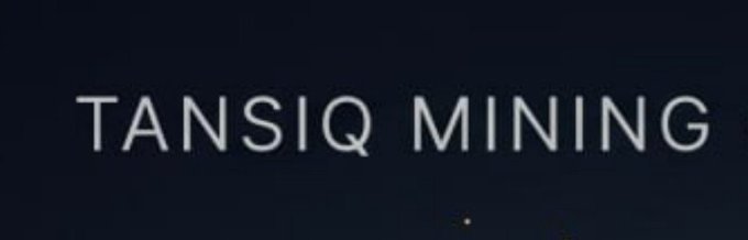 The image displays the text "TANSIQ MINING" in light lettering against a dark background, visually reinforcing the caption's message about discreetly accumulating the $TANSIQ token while broader attention is elsewhere.