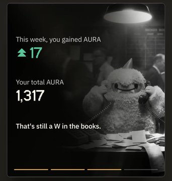 A dark-themed screen displays stats: 'This week, you gained AURA 17', 'Your total AURA 1,317', and 'That's still a W in the books,' alongside a smiling monster character.