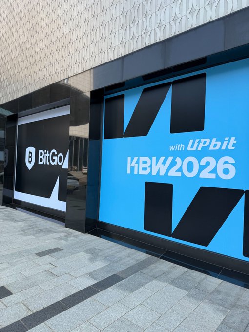 A large outdoor display features the "BitGo" logo alongside a blue banner promoting "KBW2026 with UPbit," referencing Korea Blockchain Week 2026 hosted in partnership with the Upbit cryptocurrency exchange.