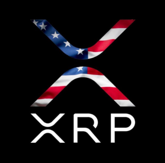 The image features the XRP cryptocurrency logo styled with the American flag pattern, including stars and red and white stripes woven into the "X" symbol. Below the graphic is the text "XRP" in bold white lettering against a black background, symbolizing U.S. patriotism and support for the XRP token.