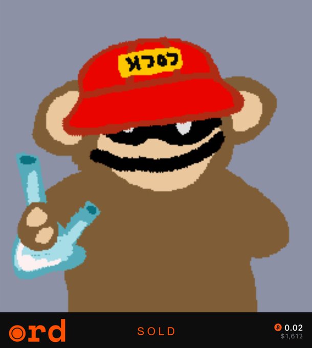 A pixel-art style illustration of a brown monkey wearing a red cap and holding up two fingers in a peace sign, with Japanese katakana text "メフメロフ" on its hat.