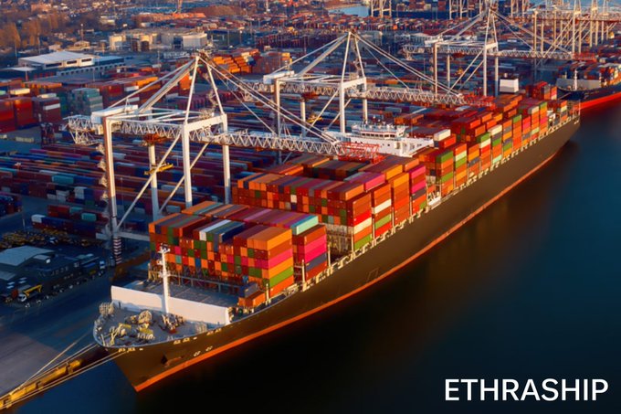 An aerial photograph of a large container ship docked at a port, loaded with colorful shipping containers, with the text 'ETHRASHIP' in the bottom right corner.