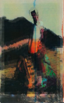 A heavily distorted, glitchy image with vertical streaks of blue, red, yellow, and black obscures an outdoor scene that appears to show a figure or structure against a landscape.