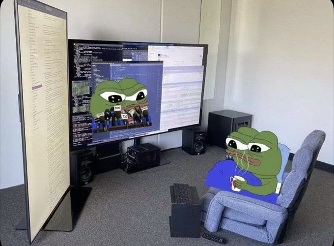 The meme shows a Pepe the Frog sitting in a comfy chair with a multi-monitor coding setup, representing a developer ready to dive into NFT season. The setup features code on the monitors with Pepe appearing in multiple places, symbolizing someone fully prepared and engaged rather than sidelined in the NFT market.