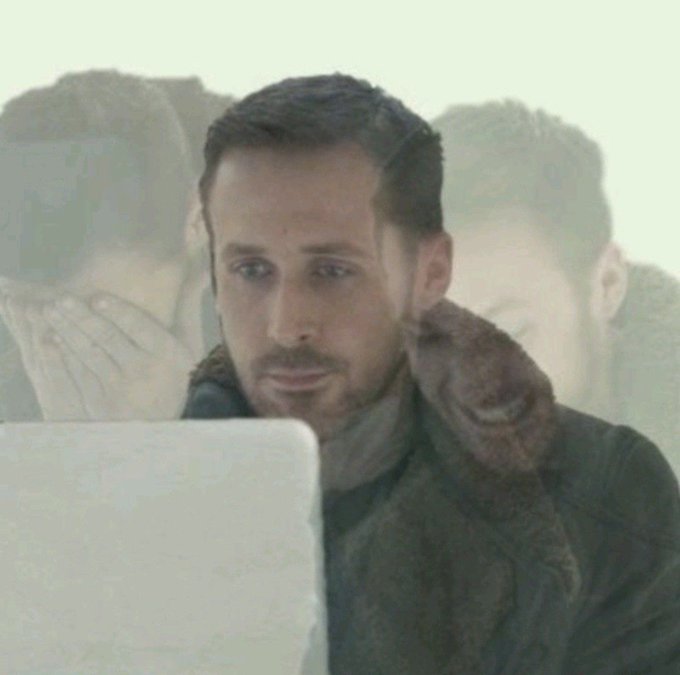 A man in a brown jacket looking at a laptop screen with a worried expression, with faded faces visible in the background suggesting anxiety or hallucinations.