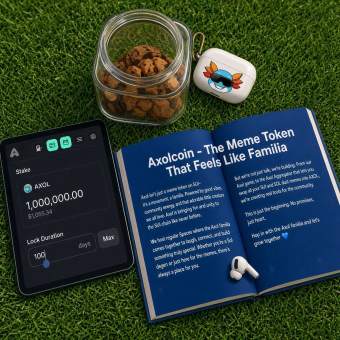A promotional setup on grass showing a smartphone displaying a stake of "1,000,000.00 AXOL" tokens worth $1,055.34, next to a jar of cookies, earbuds, and a book titled "Axolcoin - The Meme Token That Feels Like Familia".
